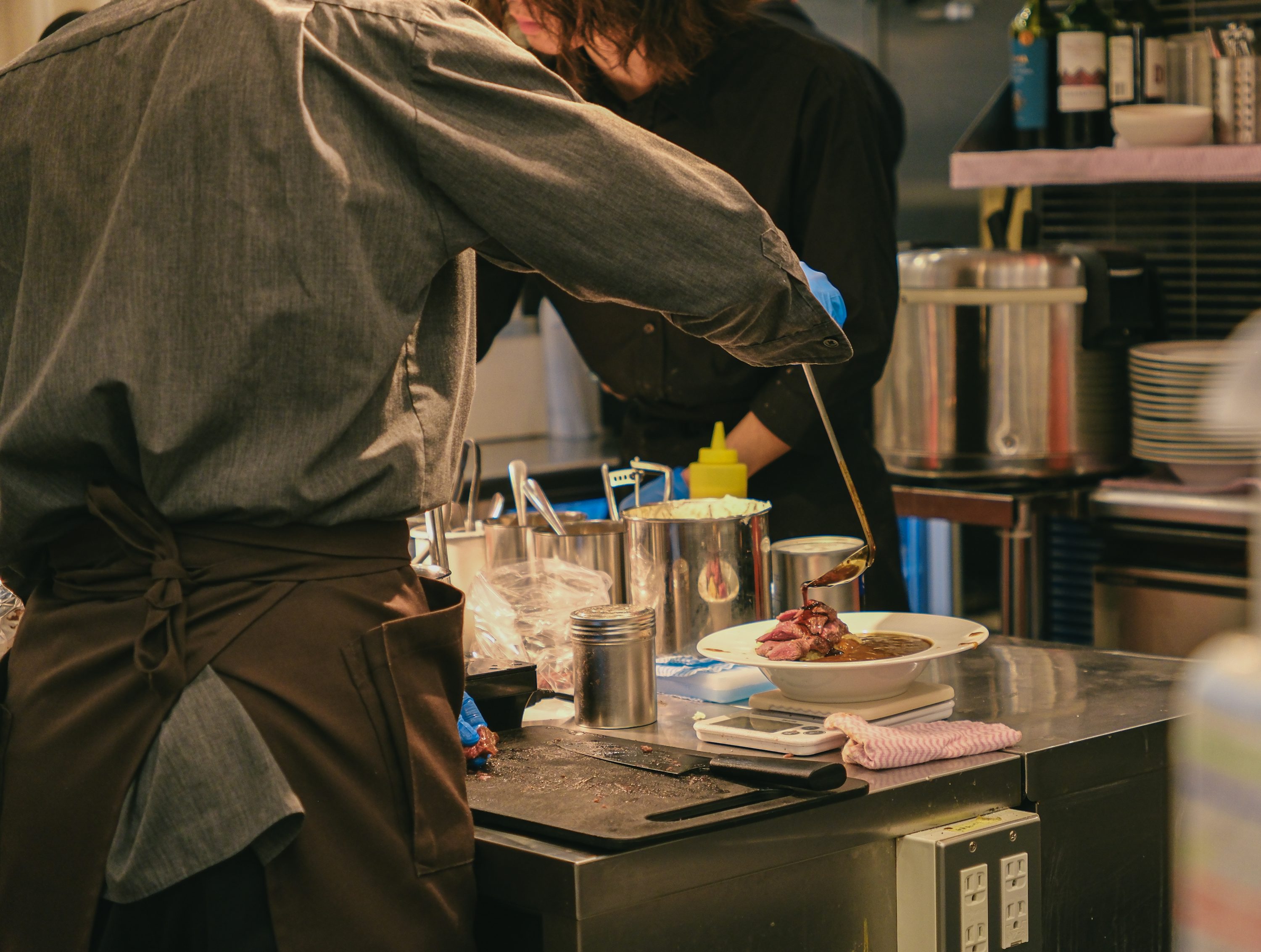Chef plating in a restaurant kitchen
