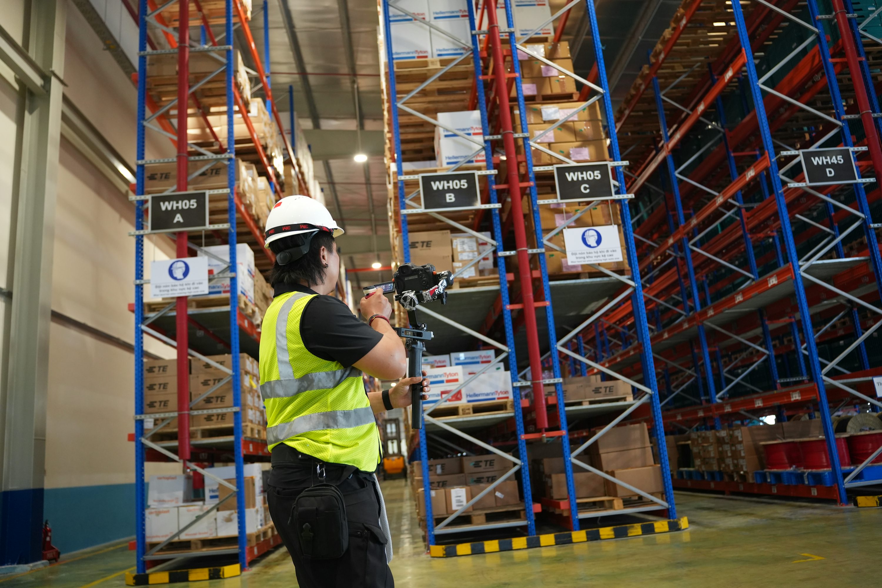 Operations lead scanning inventory in a warehouse